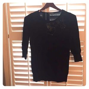 Black sweater dress with sequin bow
